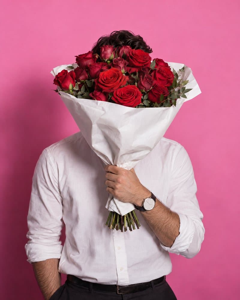 A past delivery: deep red roses wrapped in white paper